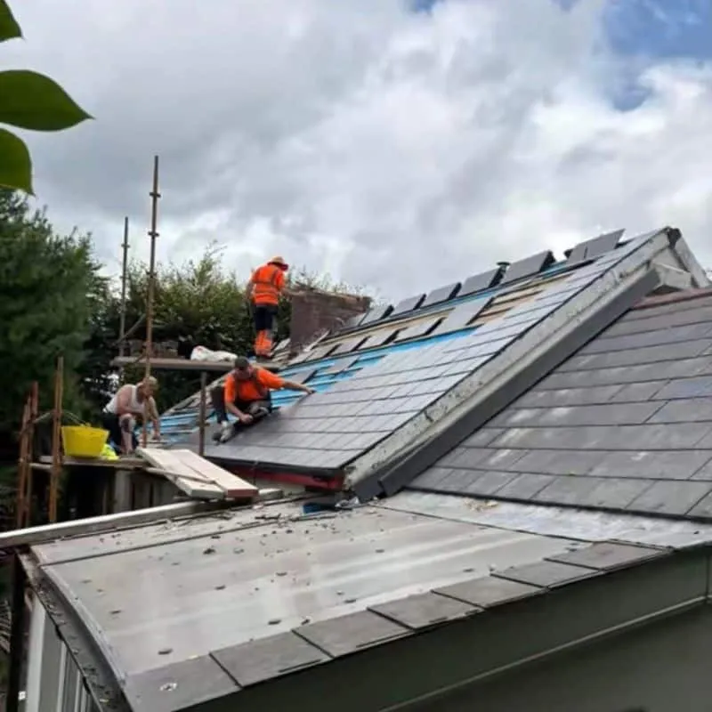 Safeguard Roofing team installing new Thrutone slates on pitched roof in Cork