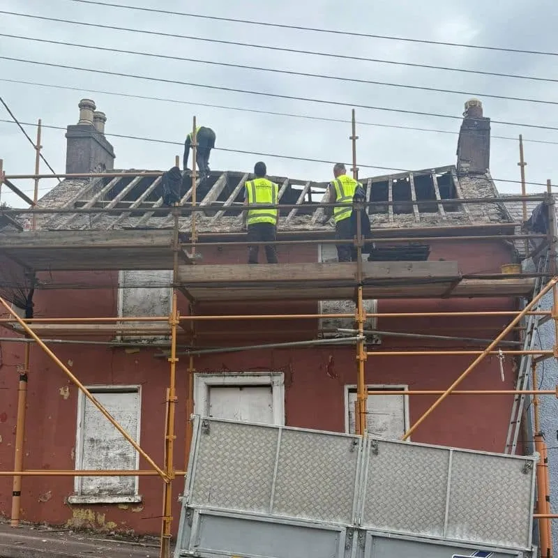 Safeguard Roofing team inspecting and stripping failed roof during restoration project in Cork