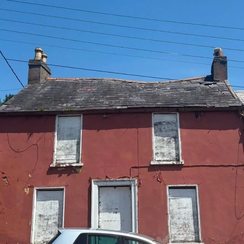 Severely deteriorated roof on vacant property in Cork before restoration work